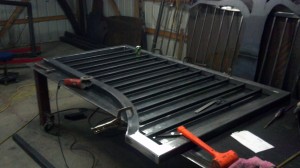 Driveway gate laying on top of welding table