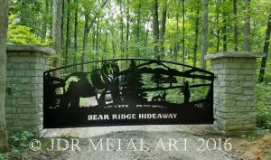 Drive gate with three bears in the design.