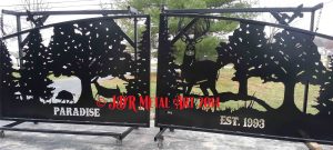 Custom driveway gate with plasma cut wildlife silhouettes for Louisiana entrance by JDR Metal Art.