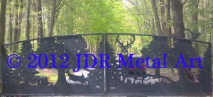 Custom driveway gates featuring steel cutouts of deer fox and trees plasma cut by JDR Metal Art.