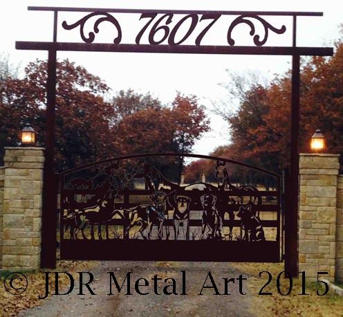 Ornamental driveway gates with three horses and five dogs theme custom made for Oklahoma City driveway entrance.