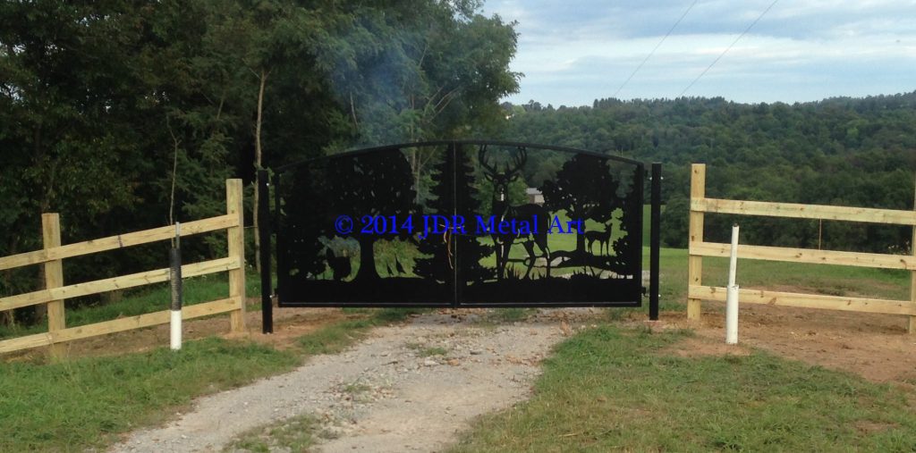 Artistic farm gate in West Virginia featuring deer and turkey silhouettes plasma cut by JDR Metal Art.