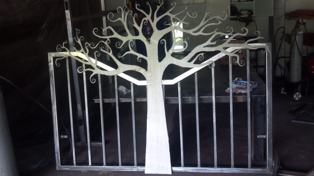 Headboard featuring plasma cut metal art tree design