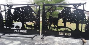 driveway gate with deer boar and duck silhouettes