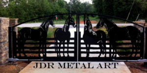 Driveway gate design with horses.