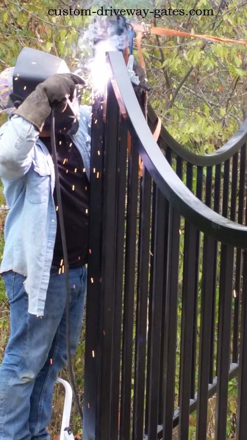 Welding a fence to post in Louisville Ky.