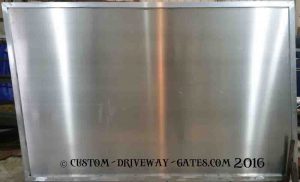 Aluminum driveway gate panel with blank sheet for privacy.