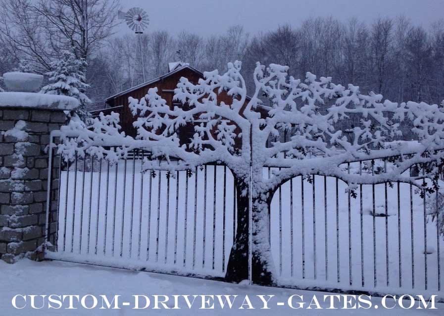 Indiana driveway gates with metal art tree.