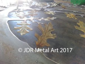 Metal oak tree with custom leaves.