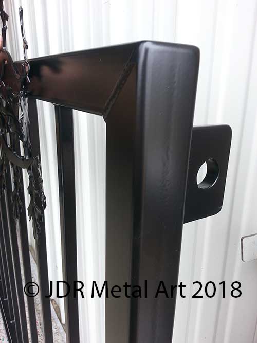 Driveway gate hinge bracket on Kansas City entry gate