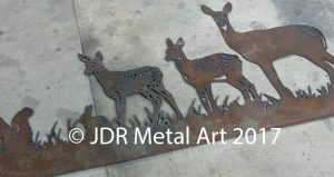 Steel plasma cut doe and fawn silhouettes for driveway gate.