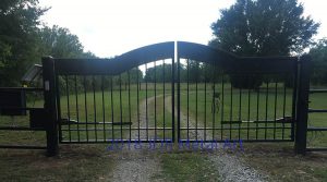 A dual swing metal gate for a Tulsa, Oklahoma driveway entrance.