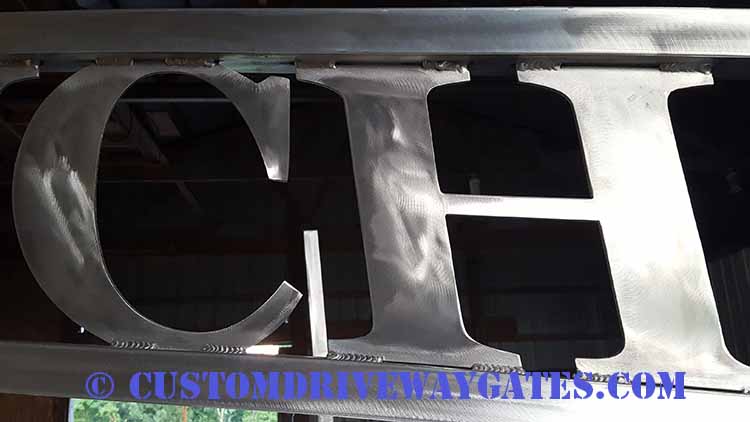 aluminum arches with plasma cut lettering for ranch
