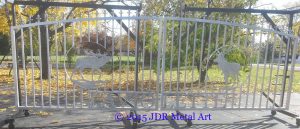 Aluminum driveway gates with pickets and spears.