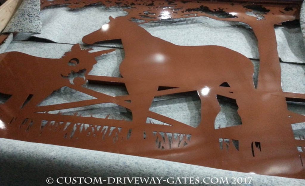 Aluminum metal driveway gates with copper finish.