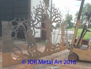 Artistic tree for estate gate being plasma cut by JDR Metal Art.