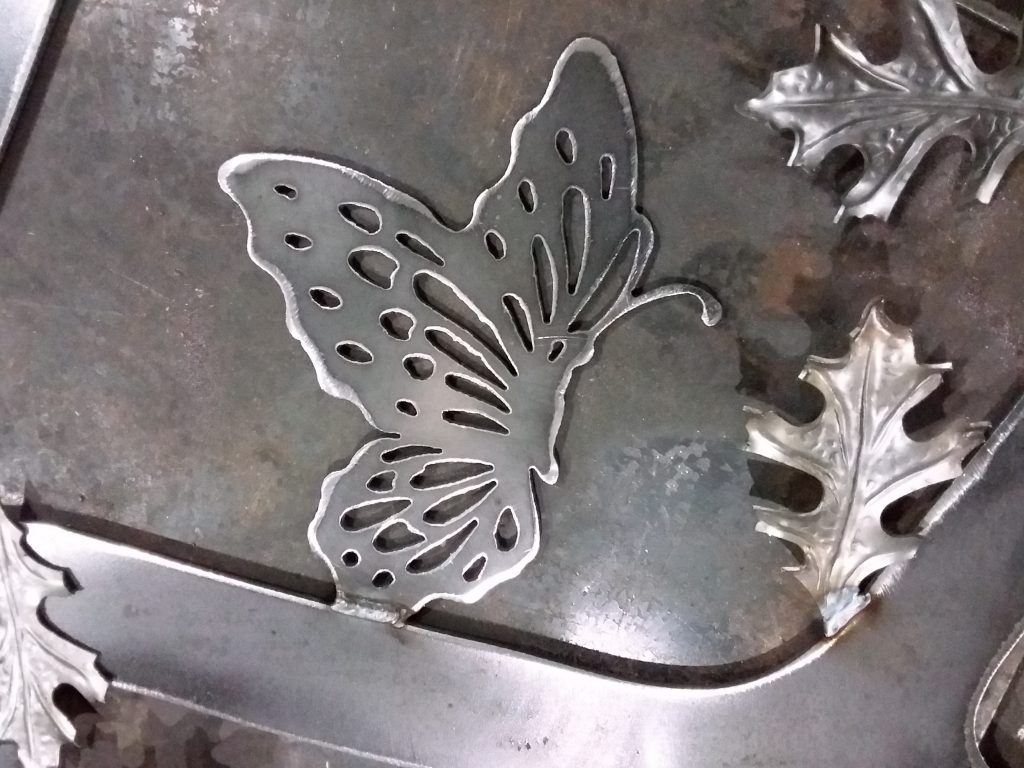 A butterfly emblem that is on ornamental driveway gate in Indiana.