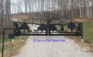 drive entry gate with ornamental tree of life and cattle farm scene plasma cut by jdr metal art