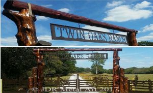 Nashville driveway gates with ranch theme, plasma cut silhouette art, a log overhead and automatic gate openers installed by JDR Metal Art.