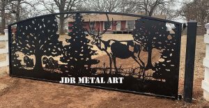 Elk driveway gate design in front of Oklahoma driveway entrance.