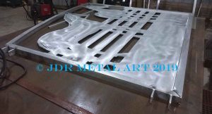Aluminum driveway gate on welding table.