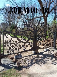 14' dual swing custom gate with maple tree design at driveway.