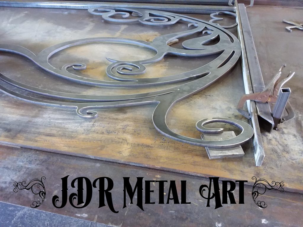 Fabrication of metal art driveway gate for Charleston, South Carolina property.
