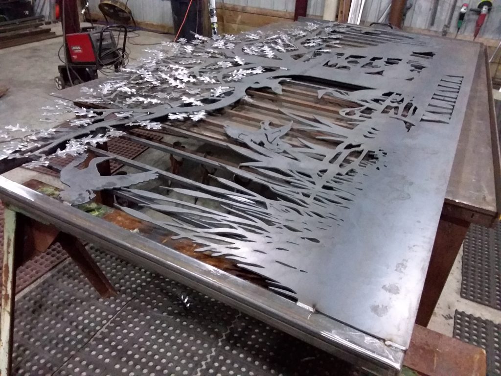 Driveway gates on a metal welding table.