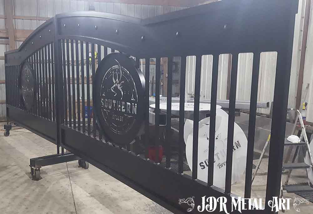 Aluminum entrance gates with black powder coat finish.