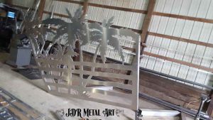 Aluminum metal art palm tree gate panel after welding.