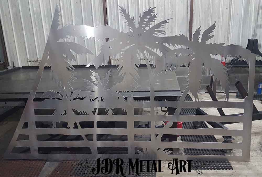 Silhouette of palm tree plasma cut from aluminum.