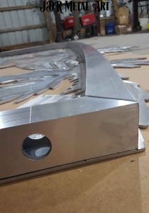 Aluminum gate frame prior to welding on fab table.