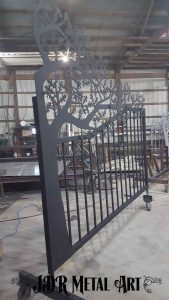 Iron oak gate with tree design powder coated in matte bronze. Photo taken before baking in powder coat oven.