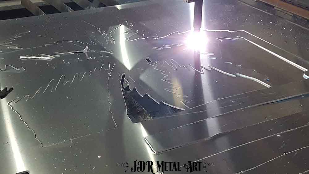 Aluminum being plasma cut on a CNC plasma table.