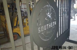 Aluminum gate sprayed with powder coat prior to oven bake.