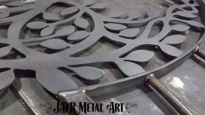 Welded custom gate pickets and tree of life cutout