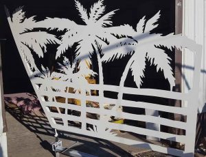 Palm tree gate panel after white powder coat finish was applied.