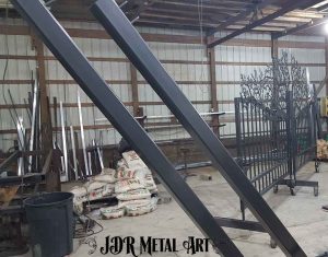 Two 4x4 iron square tubing gate posts with bronze matte finish.