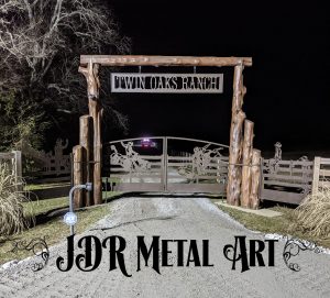 Ranch gates with design of bronco and bull rider created by JDR Metal Art.