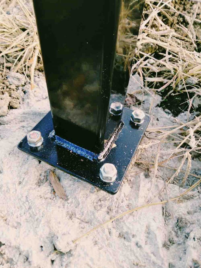 Powder coated and mig welded steel keypad stand for ranch entrance gate.