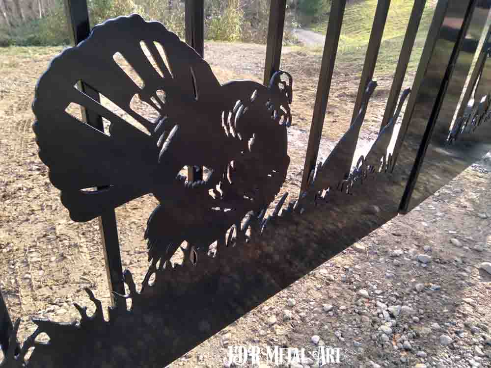 Plasma cut turkeys on ranch gate