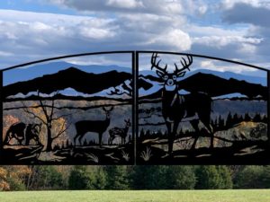 Custom gate design with personalized details including silhouettes of customer's mountains in the background.