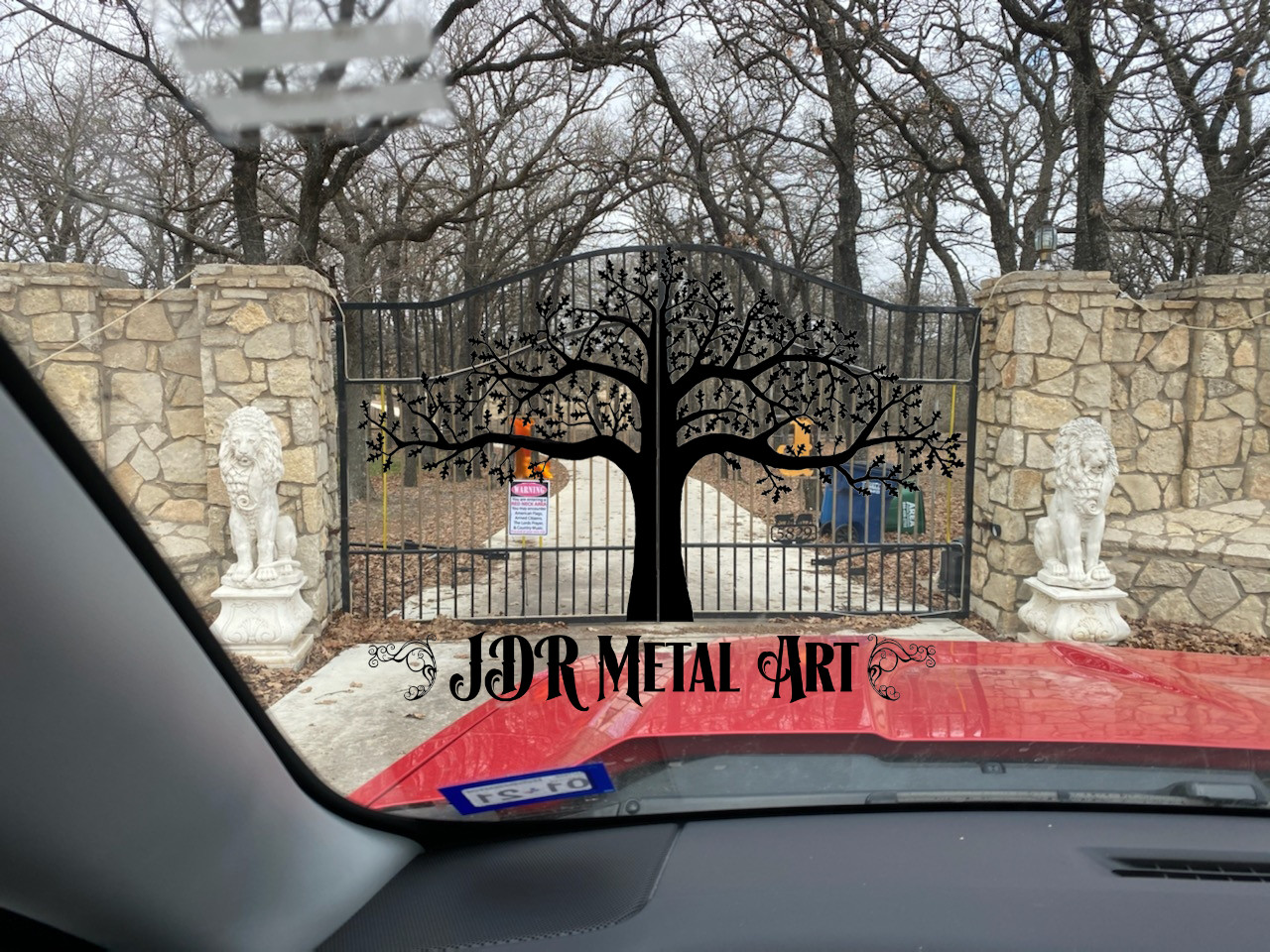 Driveway gates in DFW with decorative/ornamental oak tree.