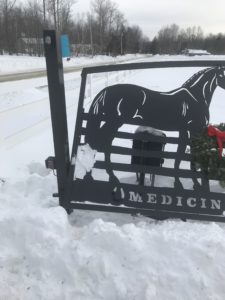 Driveway gates in need of repair after being hit by a snow plow in Maine.