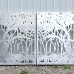 Laser cut aluminum gates with mangrove silhouette