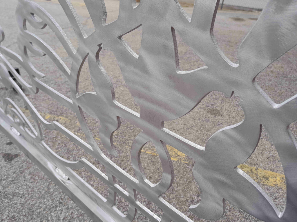 Aluminum driveway scrollwork gates made from metal with scrollwork design for Estero Florida residential community.