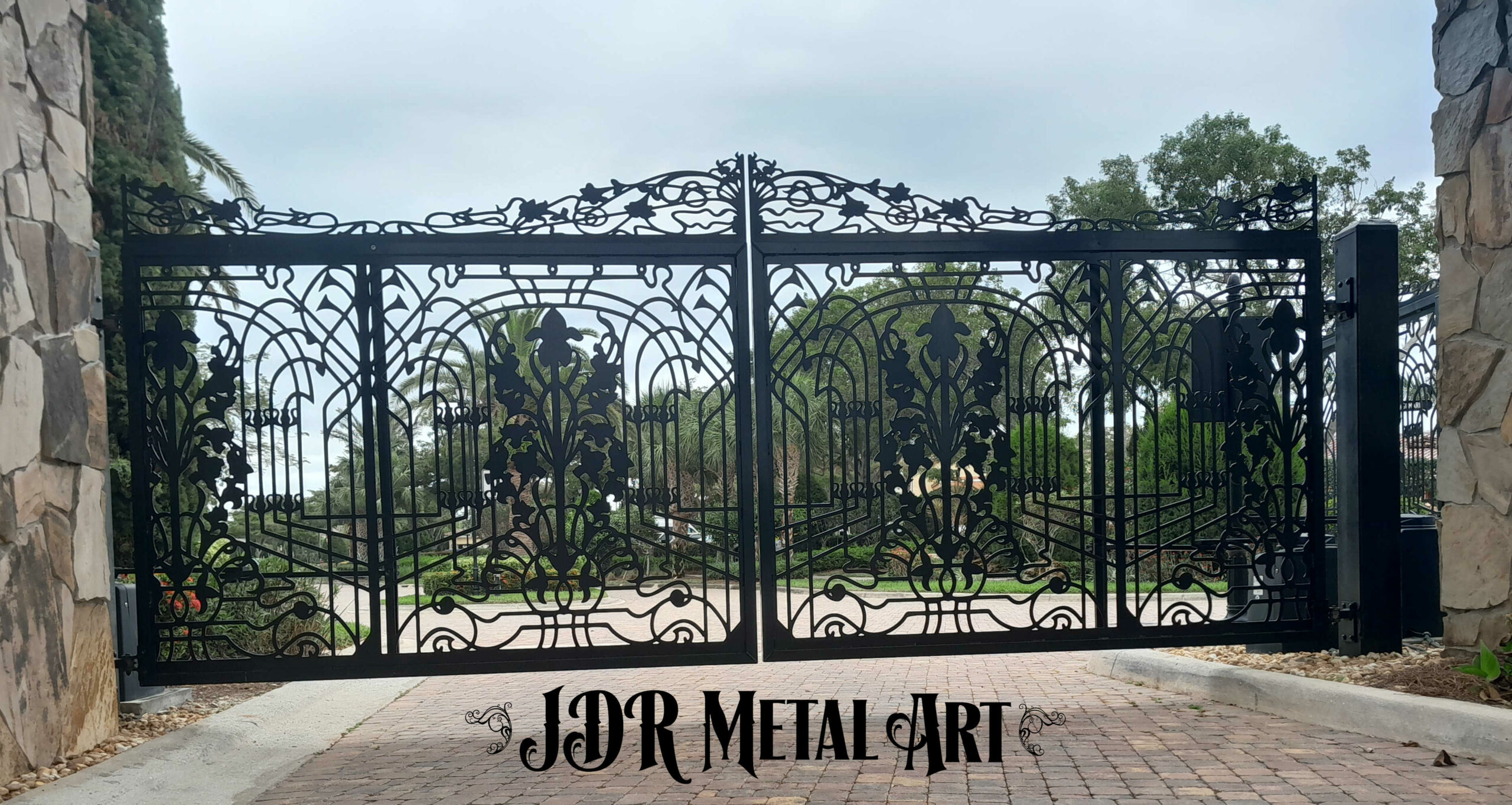 Driveway gates made from aluminum for Pensacola property entrance.