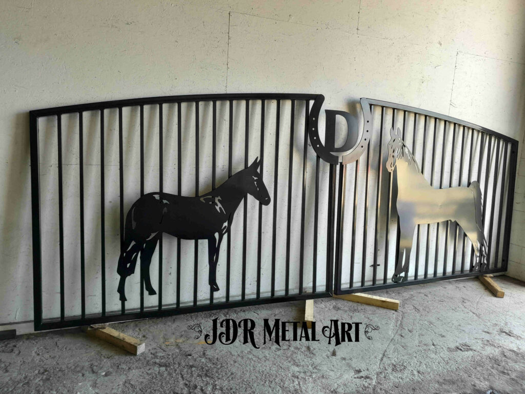 Farm gates with horse design powder coated black. Picket gate design with plasma cut horse shoe.