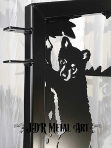 Bear metal art on driveway gate