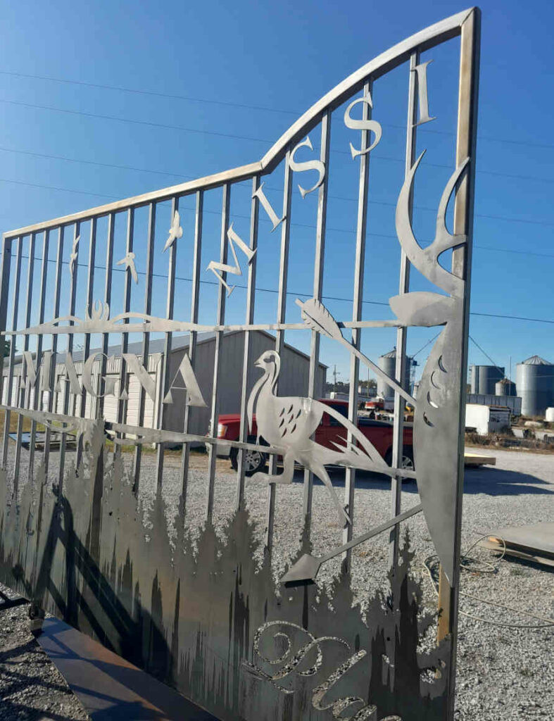 Custom gate with pickets and plasma cut metal art designs
